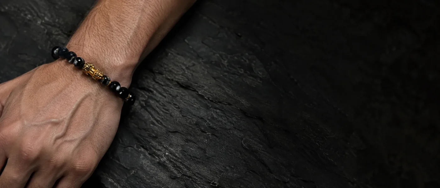 Black obsidian pixiu wealth bracelet worn on wrist for good luck and protection