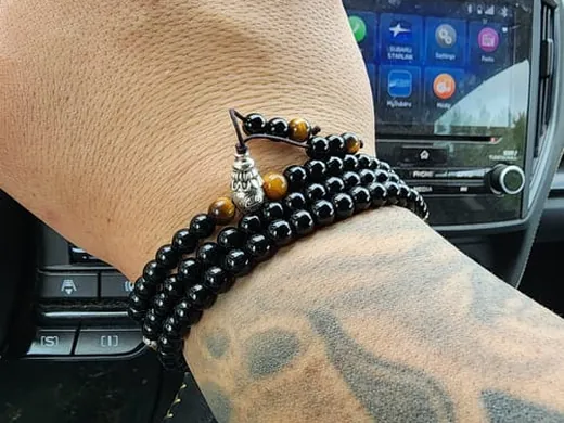 Customer wearing a black obsidian protection bracelet
