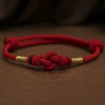 Plain dark red string bracelet with a knot, no jade bead