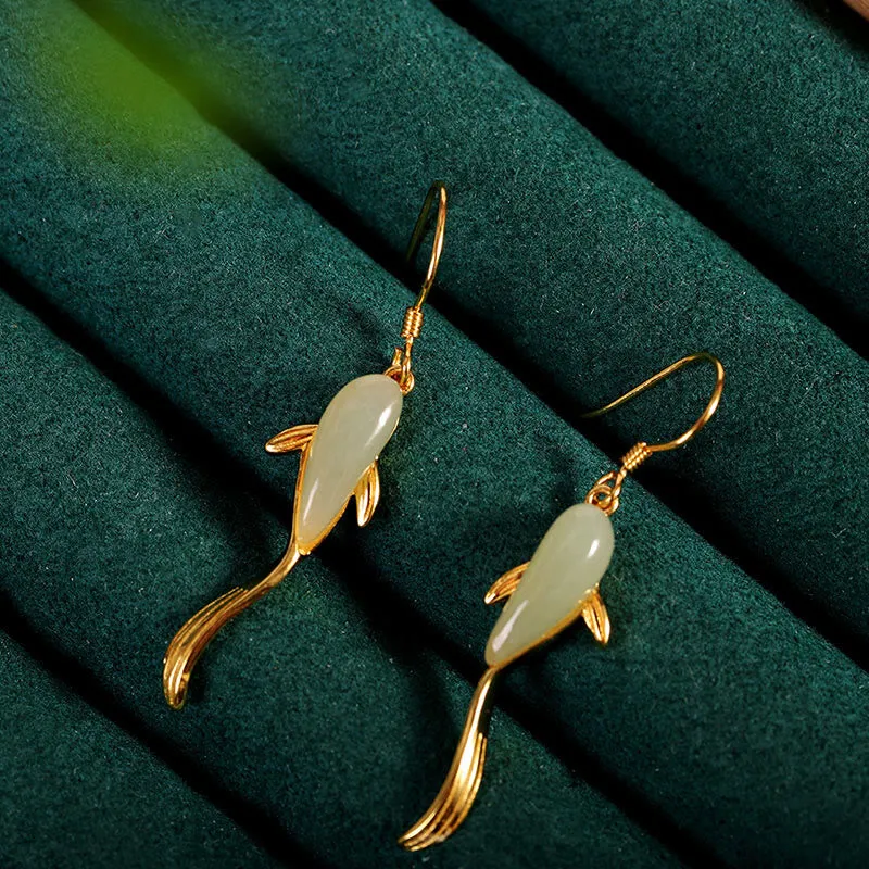 gold-koi-jade-earrings Gold koi fish earrings with pale green jade body