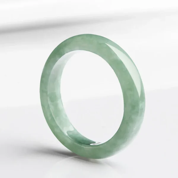 Jade prosperity ring worn on finger, abundance and good luck spiritual jewelry