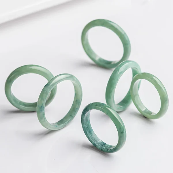 Lifestyle photo of green jade ring, abundance and prosperity healing stone