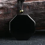 Plain back of an octagonal black obsidian pendant